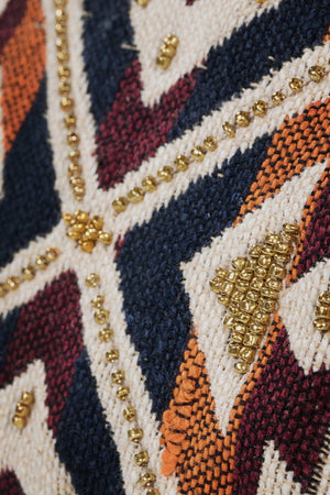 Tribal print wristlet with seed beading and suede strap in burgundy, natural, rust