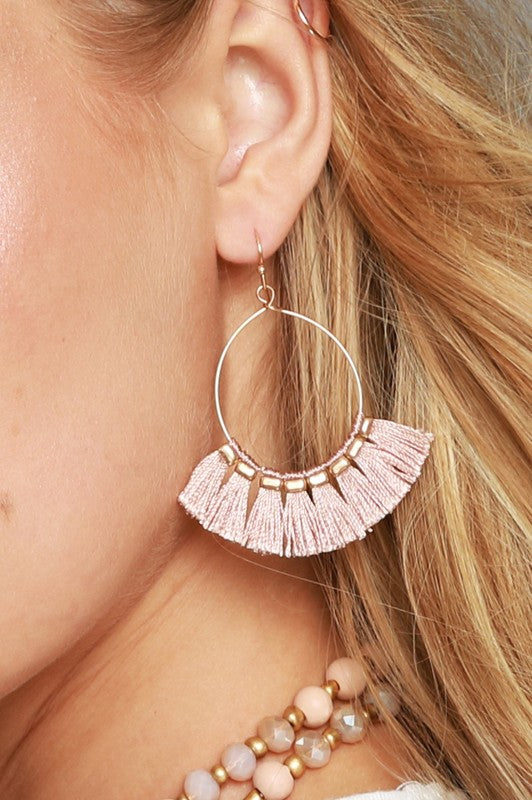 Fish hook style earrings in gold with dusty pink fine thread tassels