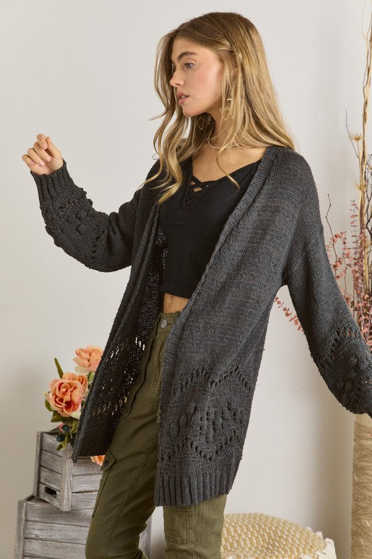 Cozy long sleeve cardigan with textured knit on lower sleeves and front border in charcoal