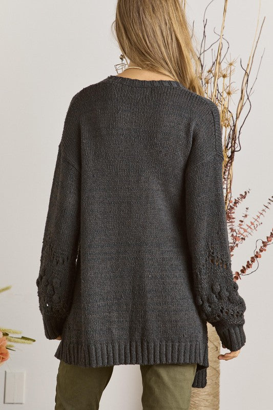 Cozy long sleeve cardigan with textured knit on lower sleeves and front border in charcoal