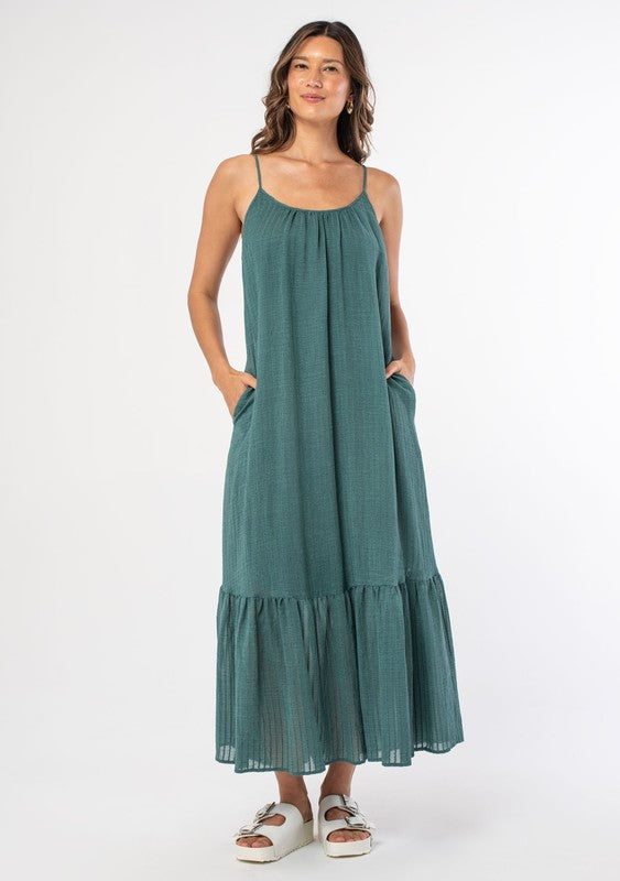 Sea Green Flowy Bohemian Maxi Dress Scooped Neckline Relaxed, Flowy Fit Maxi Length Tiered Skirt Sleeveless, Spaghetti Straps Textured Shadow Stripe Sheer Print Adjustable Strappy Tie Back Side Pockets Lined