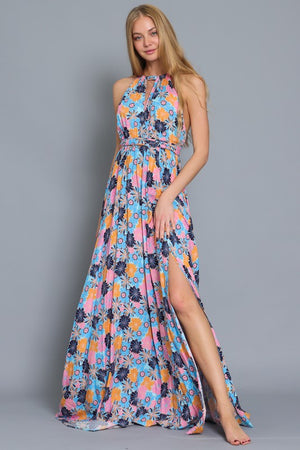 HALTER TOP WITH CRISS CROSS BACK STRAP MAXI DRESS in a floral print with shades of blue, orange, and pink