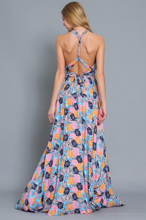 HALTER TOP WITH CRISS CROSS BACK STRAP MAXI DRESS in a floral print with shades of blue, orange, and pink