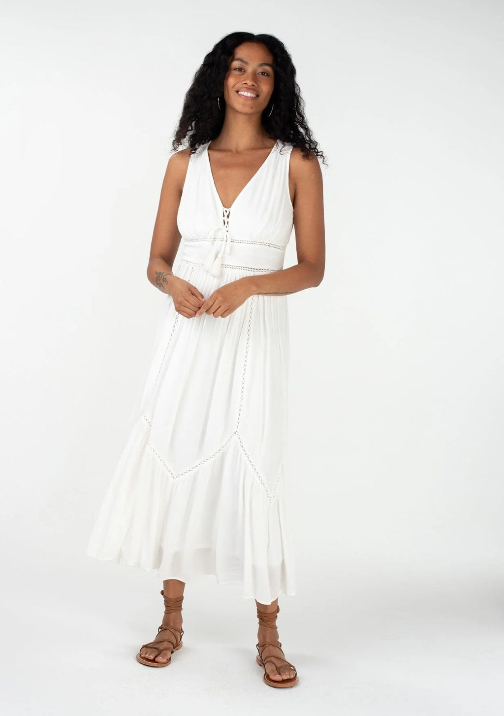  sleeveless bohemian style v-neckline maxi dress with pintuck details and a lace-up front in vanilla