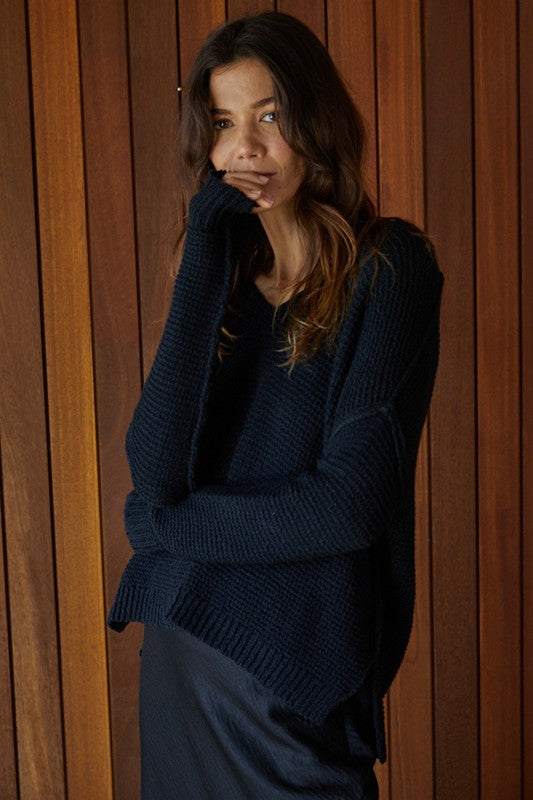 V-Neck loose fit sweater with drop shoulders and fitted sleeves in black