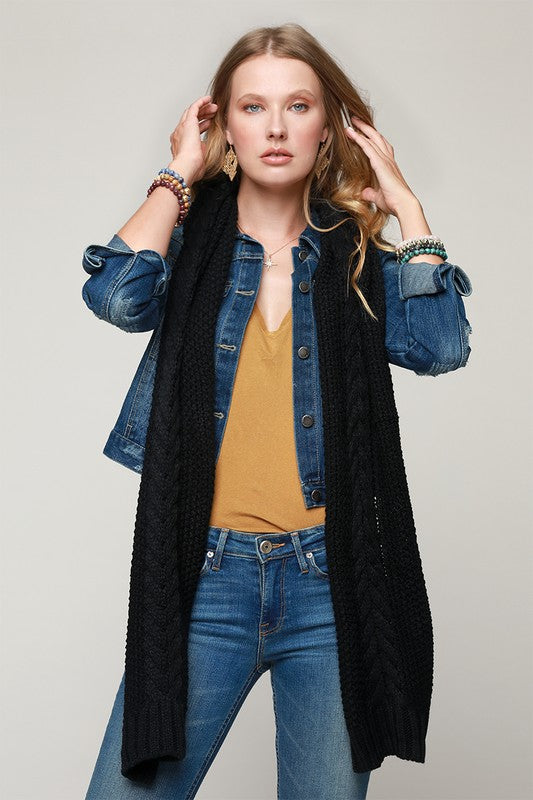 Long oblong cable knit scarf in black