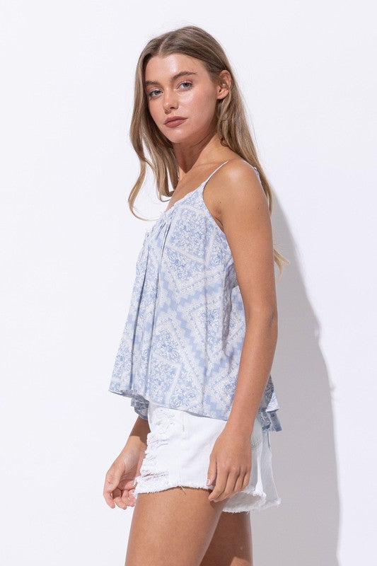 LOOSE FIT SPAGHETTI STRAP TOP with tassel tie in back and raw edge at neckline in light blue print