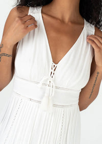  sleeveless bohemian style v-neckline maxi dress with pintuck details and a lace-up front in vanilla